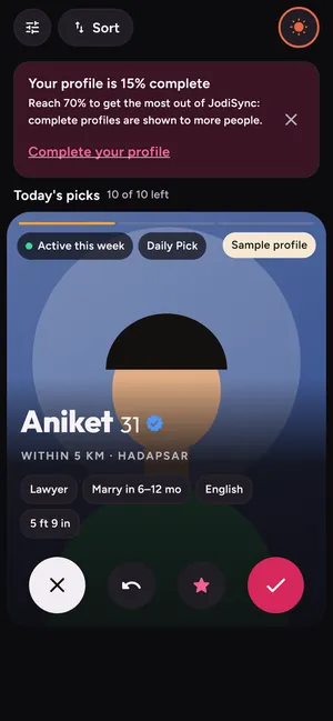 The JodiSync Discover screen: a Daily Pick card for a sample profile, Aniket, 31, within 5 km in Hadapsar, with like and pass buttons.